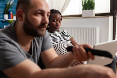 Side view of man using mobile phone