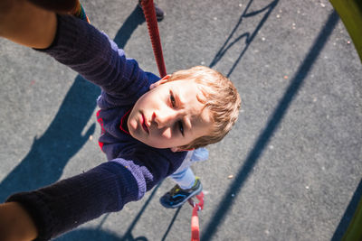 High angle view portrait of boy at playground