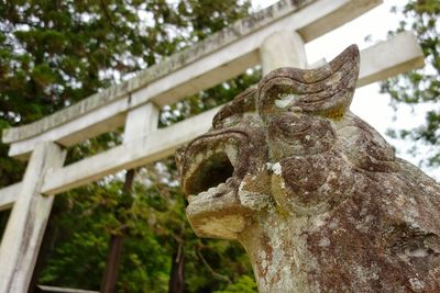 Low angle view of statue against sky