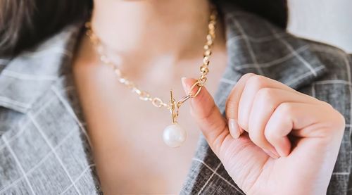 Close-up of woman holding hands