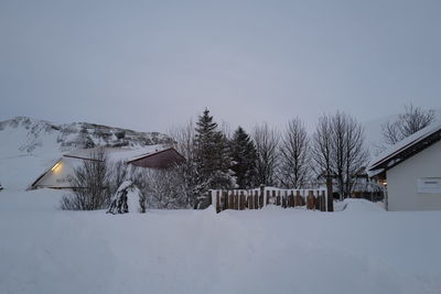 House on snow covered landscape