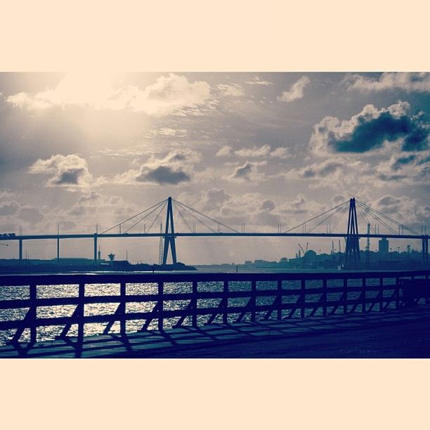 connection, bridge - man made structure, architecture, built structure, engineering, suspension bridge, sky, bridge, river, transportation, water, international landmark, travel destinations, famous place, cable-stayed bridge, cloud - sky, travel, tourism, cloud, golden gate bridge