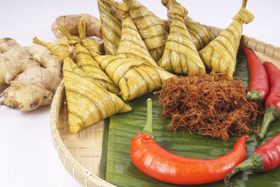 High angle view of vegetables on table against white background