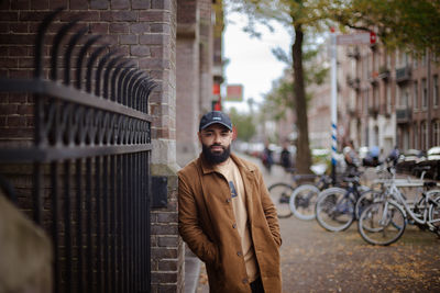 Portrait of young man standing on street