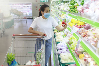 Woman standing at market stall