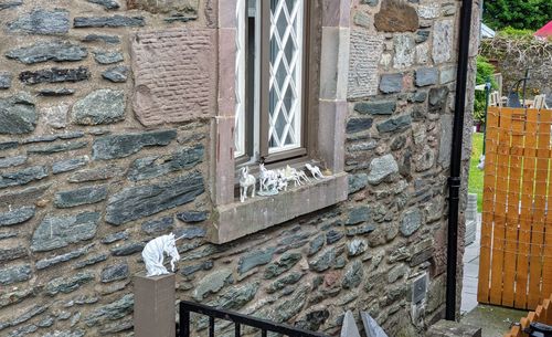 Low angle view of window on building wall