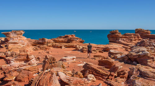 Scenic view of sea against clear blue sky