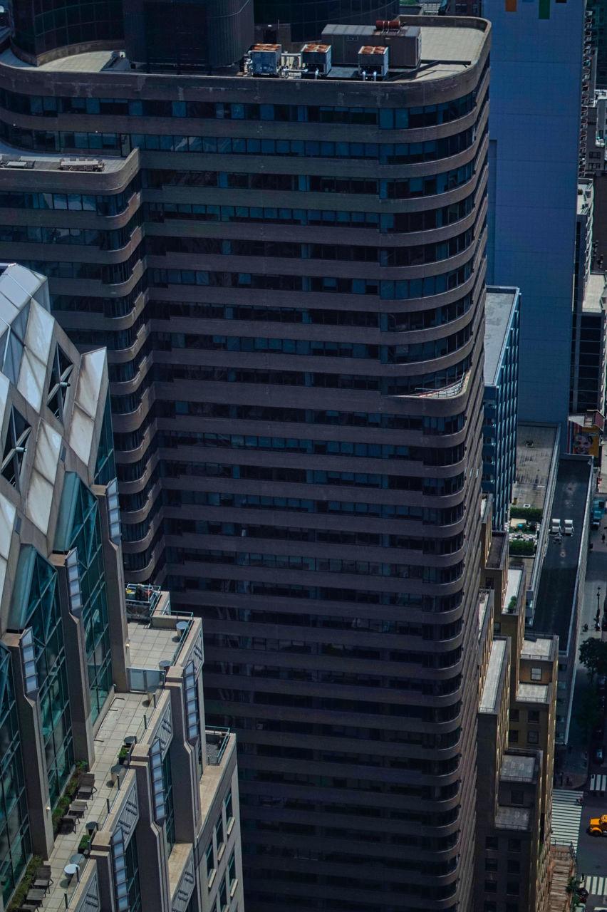 HIGH ANGLE VIEW OF MODERN BUILDINGS AGAINST CITY