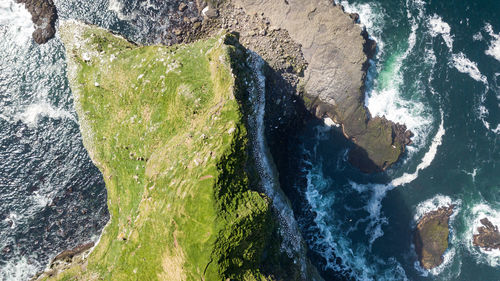 High angle view of rock formation in sea