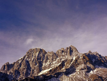 Scenic view of mountains against sky during winter