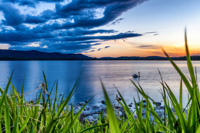 Scenic view of lake against sky during sunset