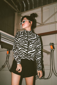 Portrait of thai girl with double bun wearing zebra print top