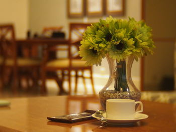 Close-up of vase on table at home