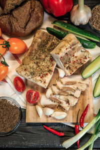 High angle view of pizza on cutting board