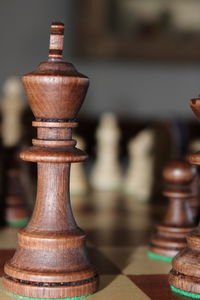 Close-up of chess pieces on table