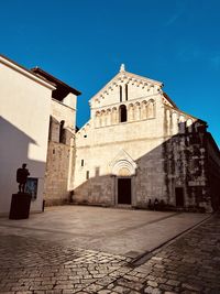 Low angle view of old building against sky