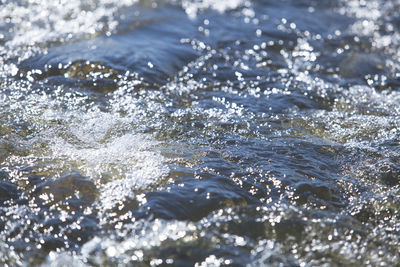 Close-up of water splashing in sea