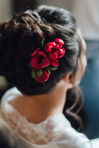 Close-up of woman with red rose