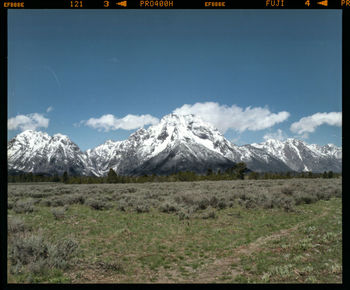 Scenic view of snowcapped mountains against sky