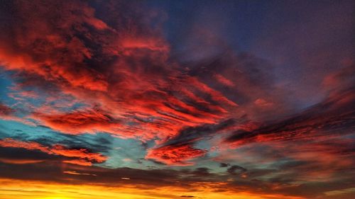 Low angle view of dramatic sky during sunset