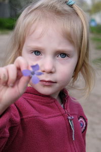 Close-up of cute girl blowing bubbles