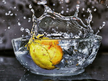 Close-up of lemon in glass