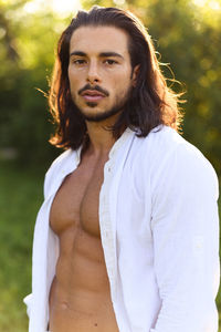 Portrait of young man standing outdoors