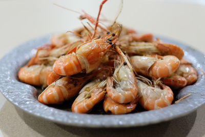 Close-up of prawns in plate on table