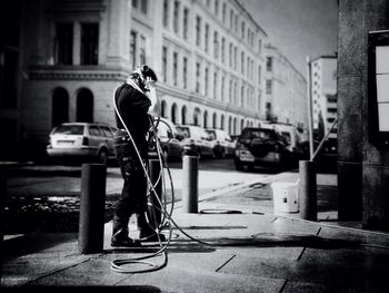 Woman standing on city street