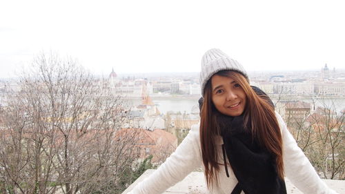 Portrait of woman standing with danube river in background