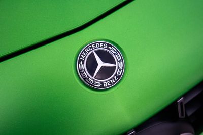 High angle view of clock on green background