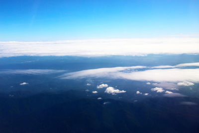 Aerial view of clouds over landscape against sky