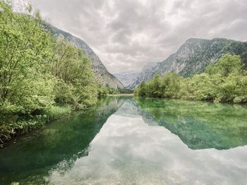 Scenic view of lake and mountains against sky