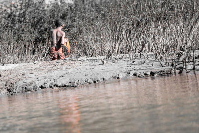 Woman standing in water