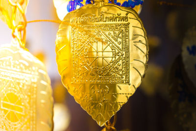 Close-up of clothes hanging on yellow