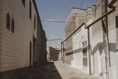 Bukhara street amidst buildings against sky