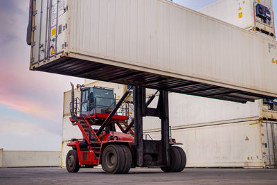 Bicycles on pier against sky