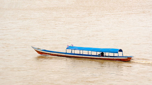 Boat moored on beach