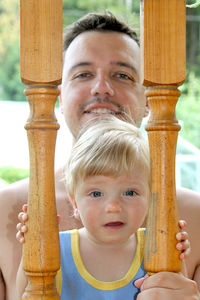 Portrait of cute boy holding camera