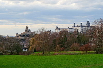 Buildings against cloudy sky