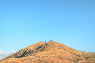 A hill with blue sky in the background, at labuan bajo, east nusa tenggara, indonesia