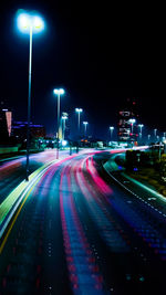 High angle view of light trails on road at night