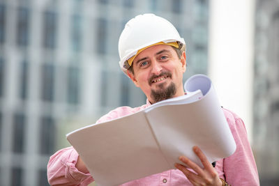 Portrait of man working at construction site