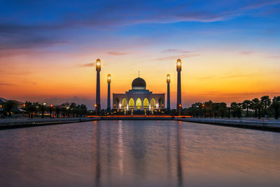 Illuminated masjid songkhla against sky during sunset