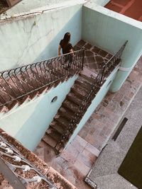 High angle view of woman on staircase