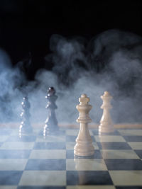 Close-up of chess pieces on table