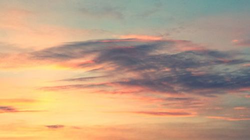 Low angle view of cloudy sky at sunset