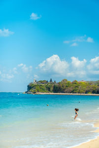 Scenic view of sea against blue sky