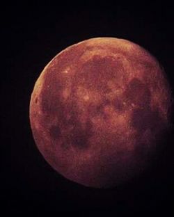 Close-up of moon over black background