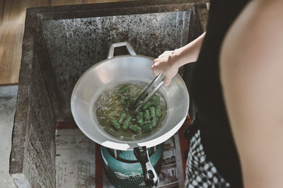 Midsection of woman preparing food